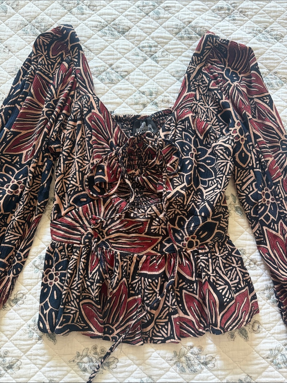 Angie Black and Burgundy Floral Smocked Peplum Top